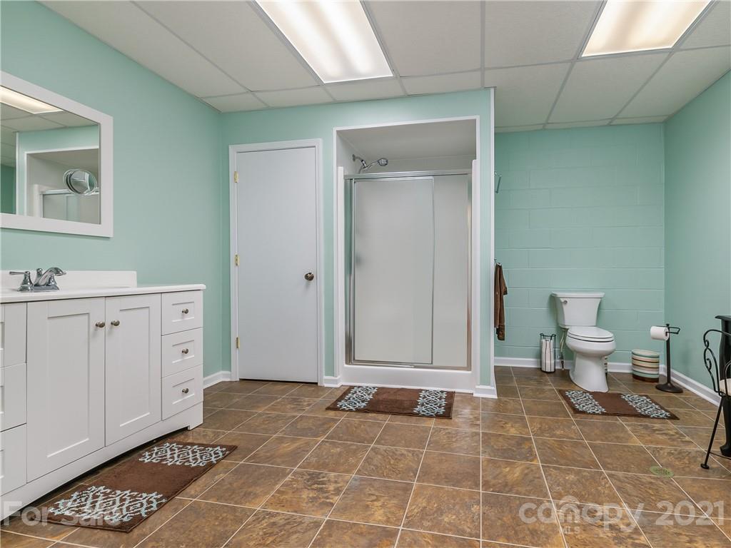 631 Pleasant Hill Church Road Rutherfordton, NC 28139 - Photo 40 of 48 a spacious bathroom with a mirror and a toilet