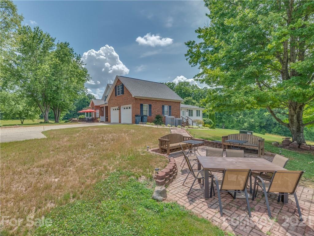 631 Pleasant Hill Church Road Rutherfordton, NC 28139 - Photo 8 of 48 a view of a house with a yard porch and sitting area