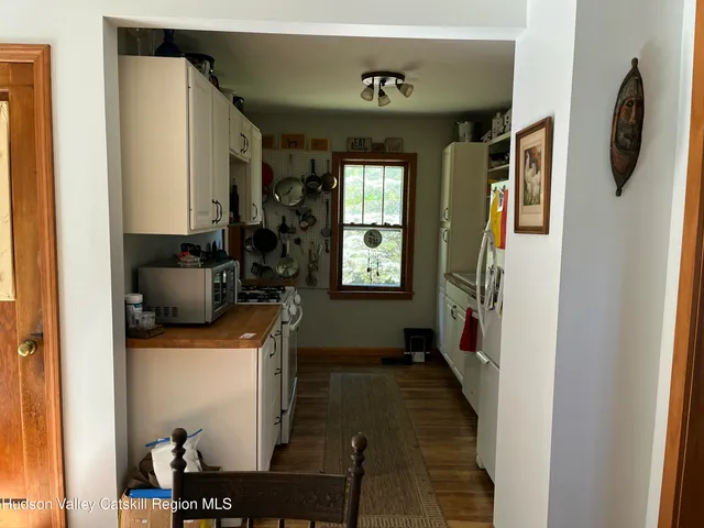 a hallway with furniture and a window