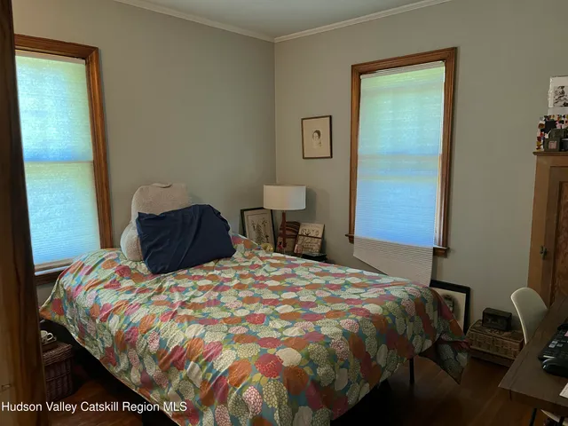 a bedroom with a bed and a table in it