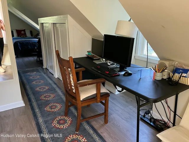 a view of a workspace with furniture