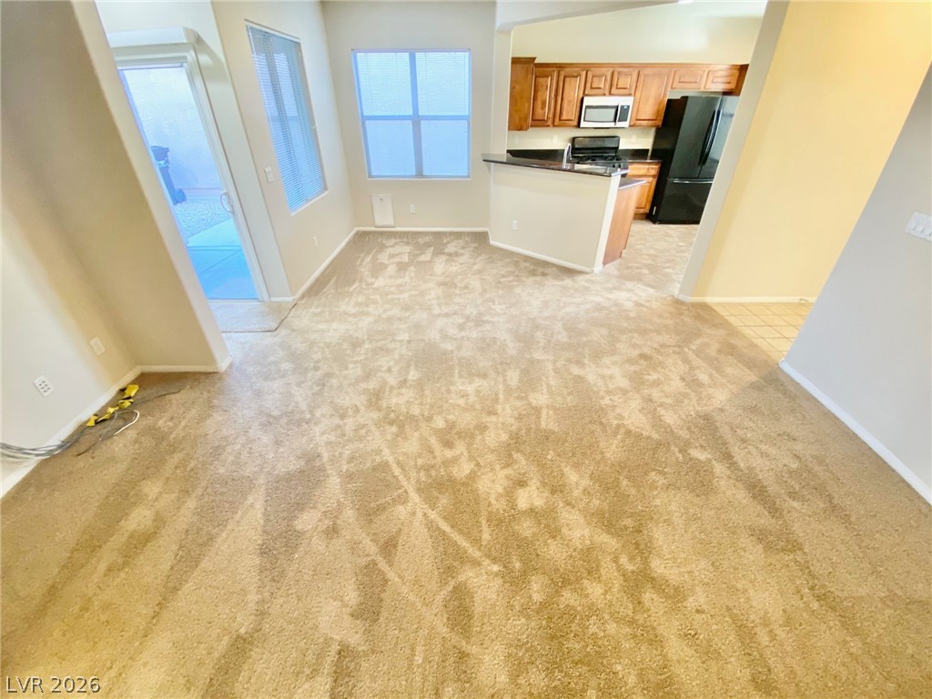8569 Rhamus Court Las Vegas, NV 89149 - Photo 35 of 35 An open floorplan seamlessly connects the living space to a well-appointed kitchen.