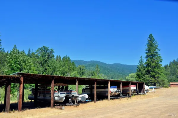 a view of house with car parked
