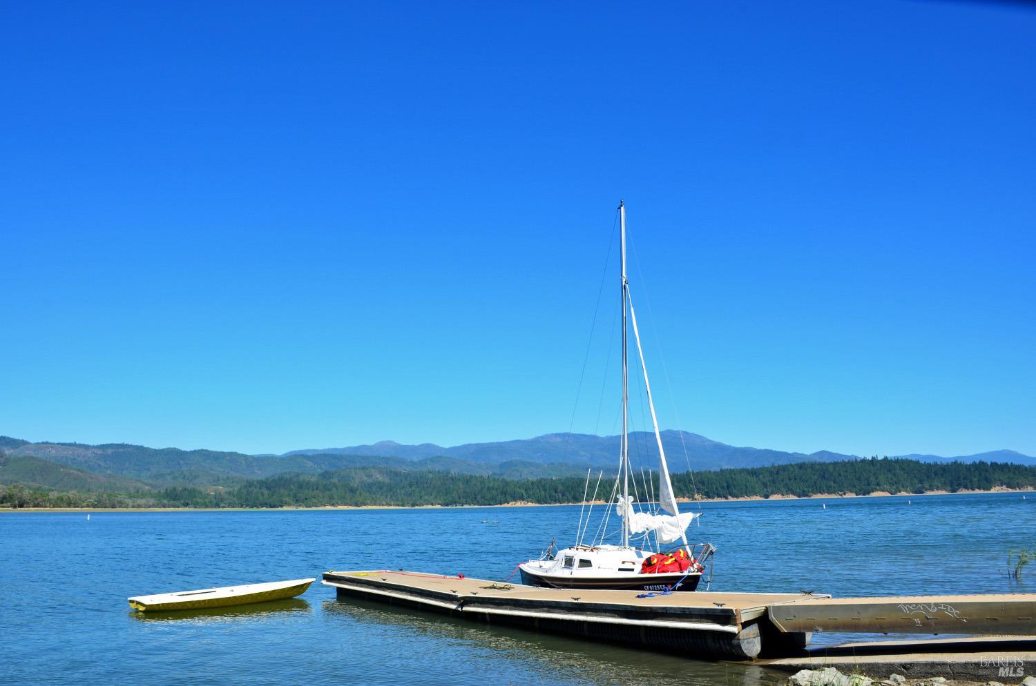 30477 Rodeo Road Potter Valley, CA 95469 - Photo 29 of 33 a view of a lake with a mountain in the background