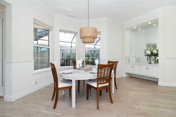 a dining room with furniture and window