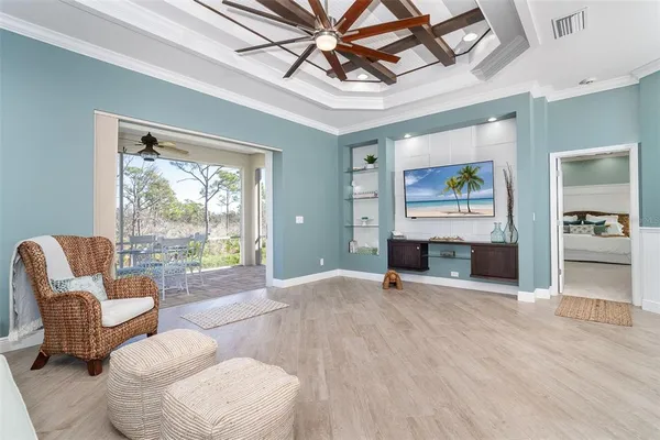 a living room with furniture and wooden floor