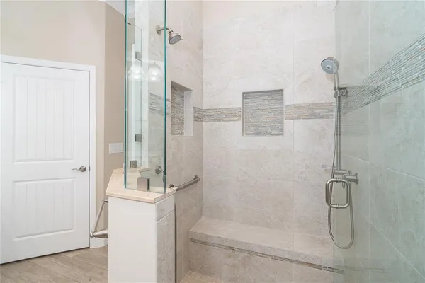 a room with white cabinets and sink