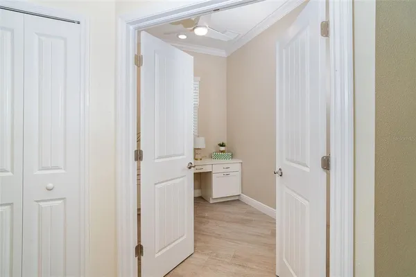 a room with a white cabinets and window