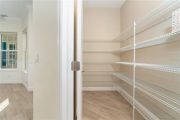 a view of a storage and utility room with washer and dryer
