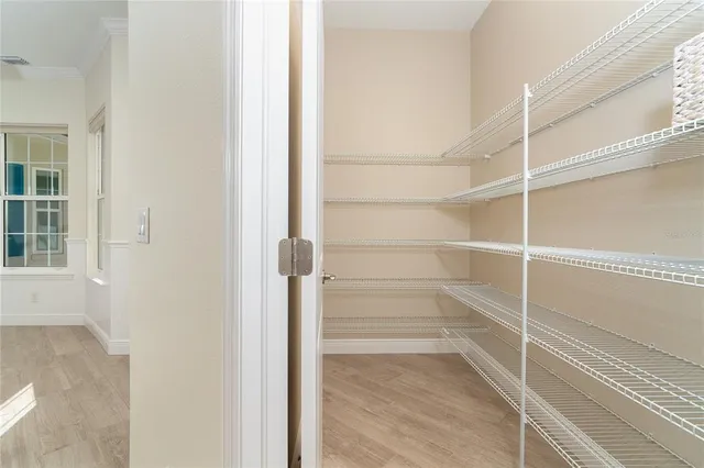 a view of a storage and utility room with washer and dryer