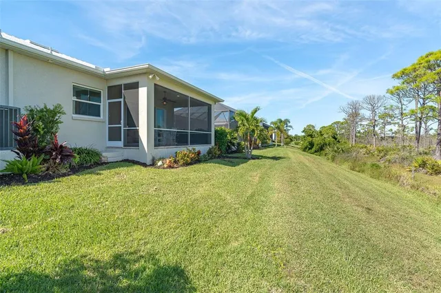 an aerial view of a house with a lake view