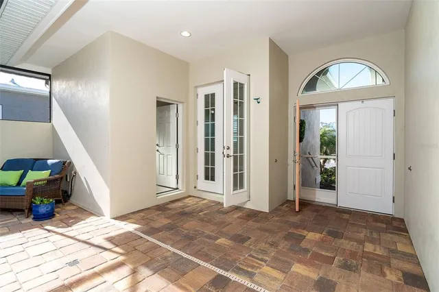 a view of a livingroom with wooden floor and furniture