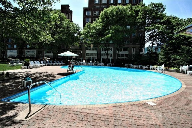 a view of a swimming pool with a patio