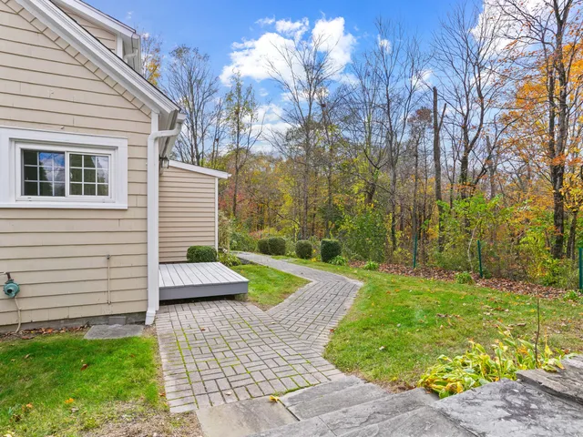 a view of backyard with seating space