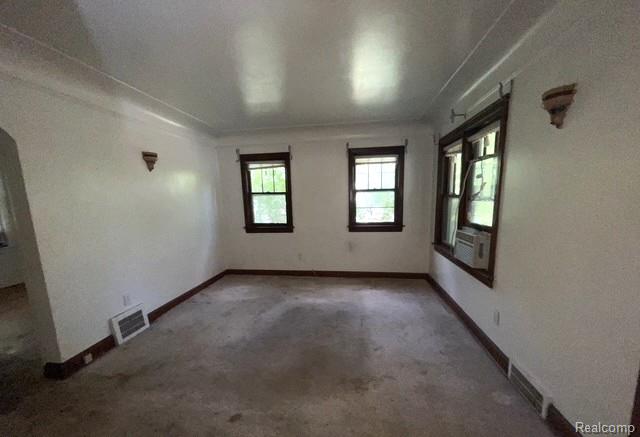 8930 Wayne Road Romulus, MI 48174 - Photo 2 of 18 Neutral wall finishes, wood-trim windows, and crown molding