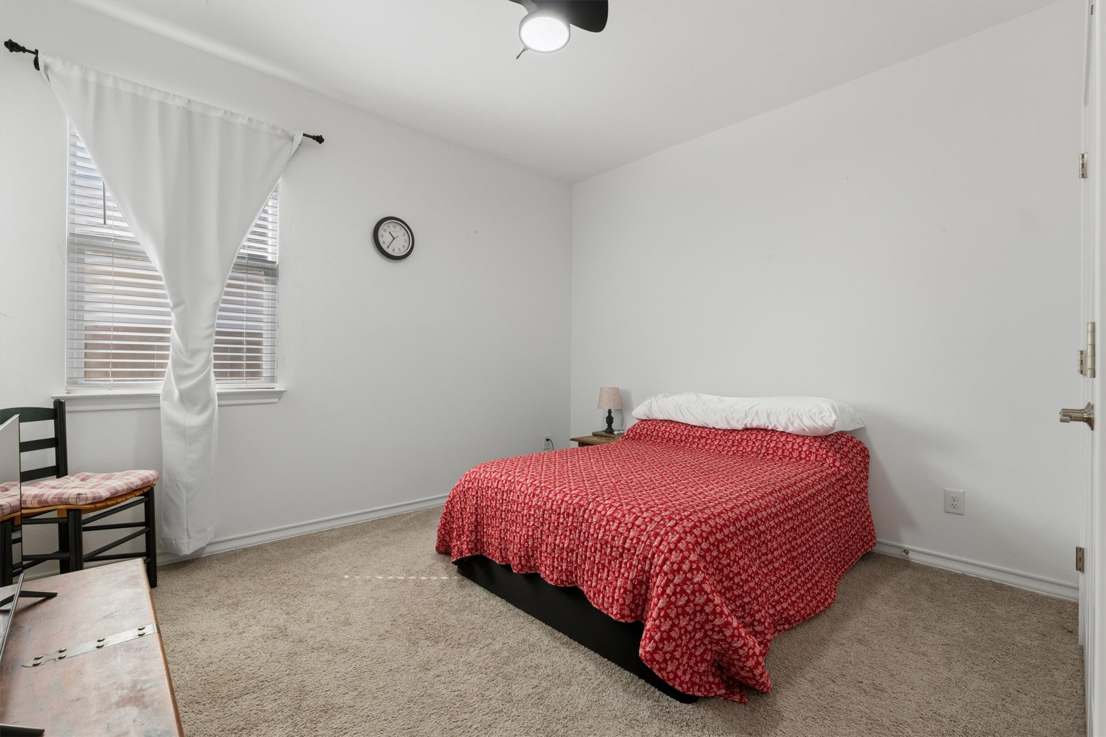 1000 Moose Road Hutto, TX 78634 - Photo 17 of 29 Bedroom with light colored carpet and a ceiling fan