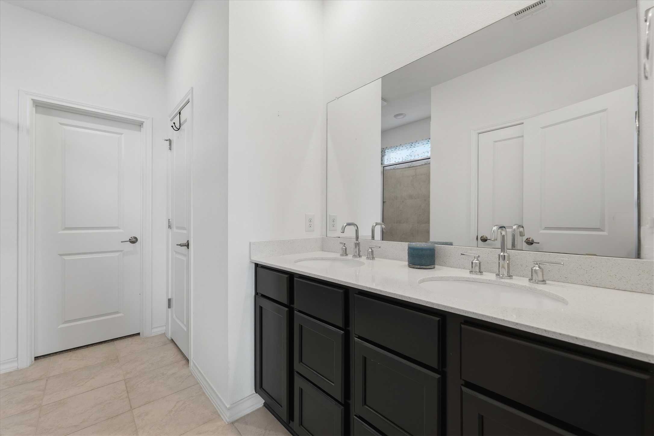 1000 Moose Road Hutto, TX 78634 - Photo 22 of 29 Bathroom featuring double vanity and light tile patterned flooring
