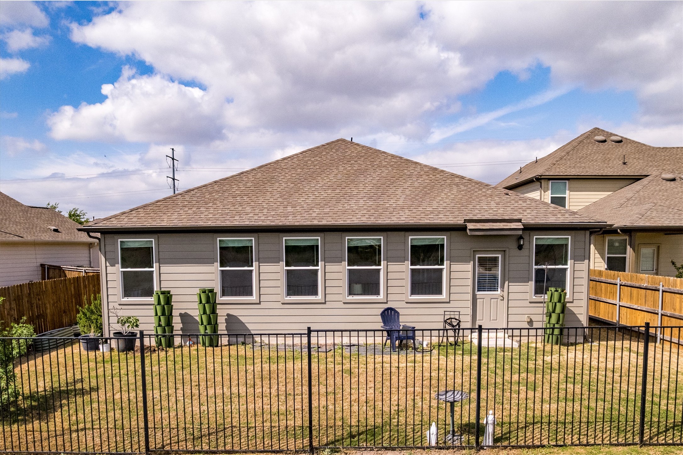 1000 Moose Road Hutto, TX 78634 - Photo 25 of 29 Back of house with a fenced backyard and a shingled roof