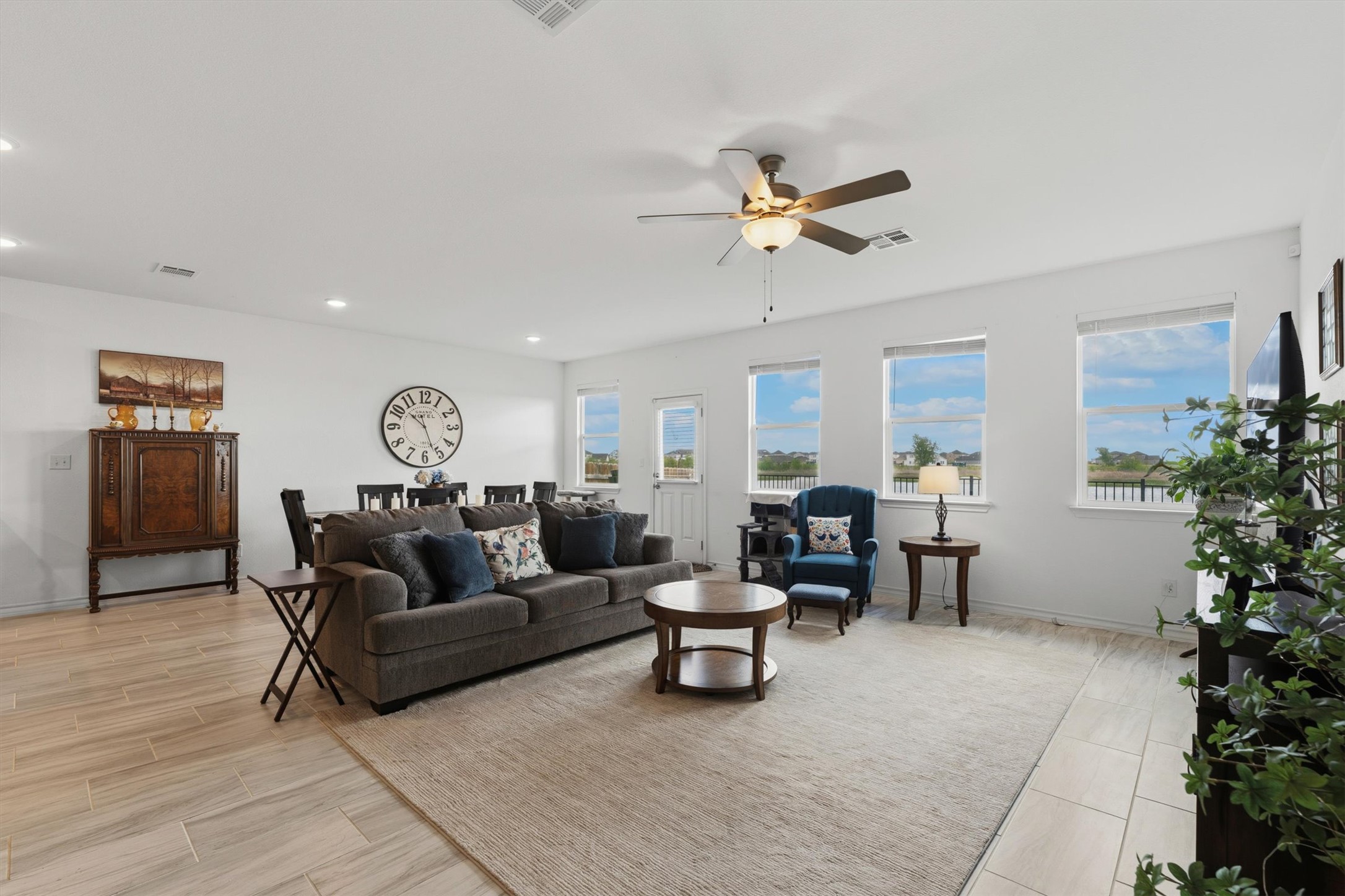 1000 Moose Road Hutto, TX 78634 - Photo 7 of 29 Living room featuring a ceiling fan, wood tiled floors, and recessed lighting