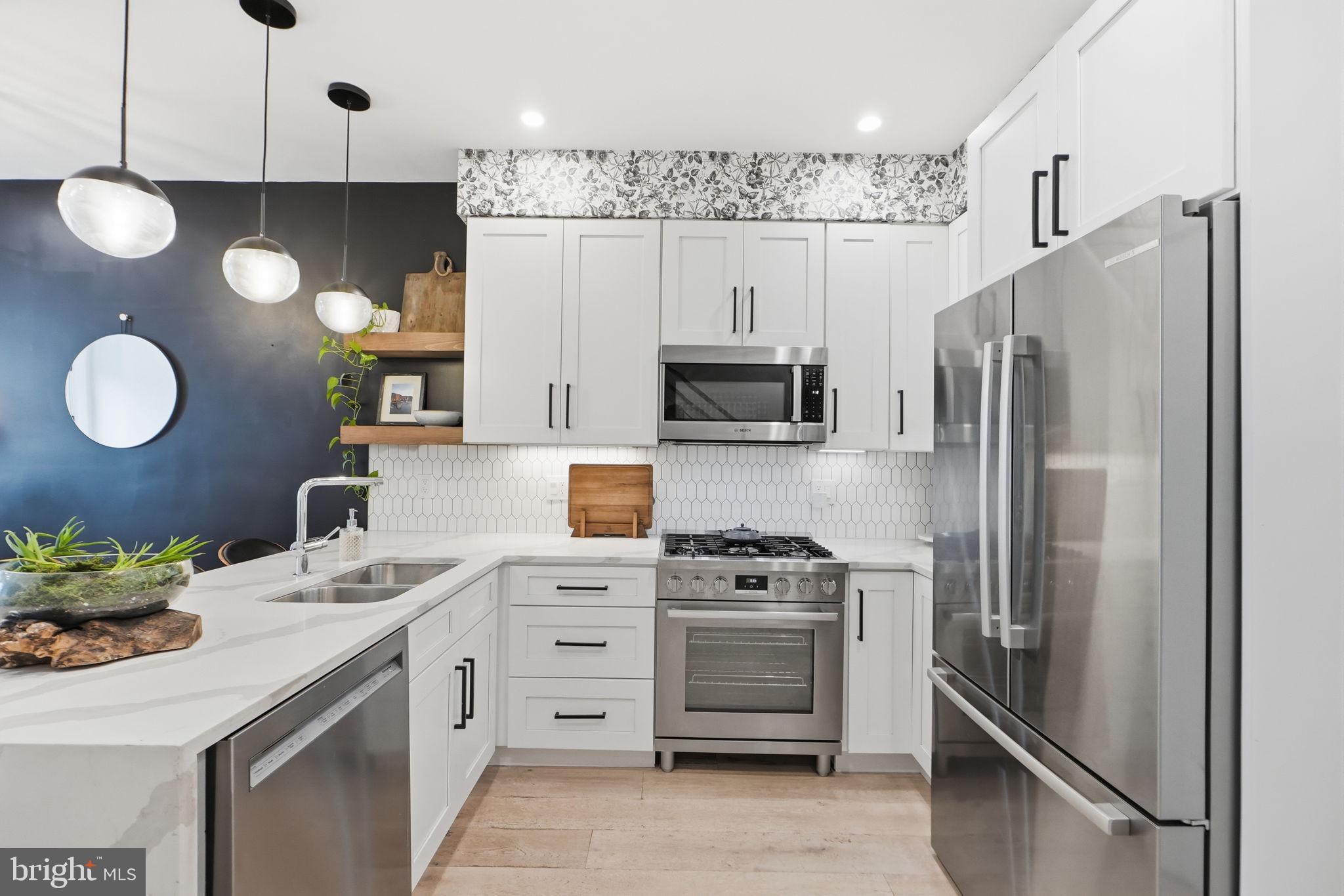 1216 I Street Northeast, Unit B Washington, DC 20002 - Photo 6 of 40 Classic white cabinetry and SS appliances