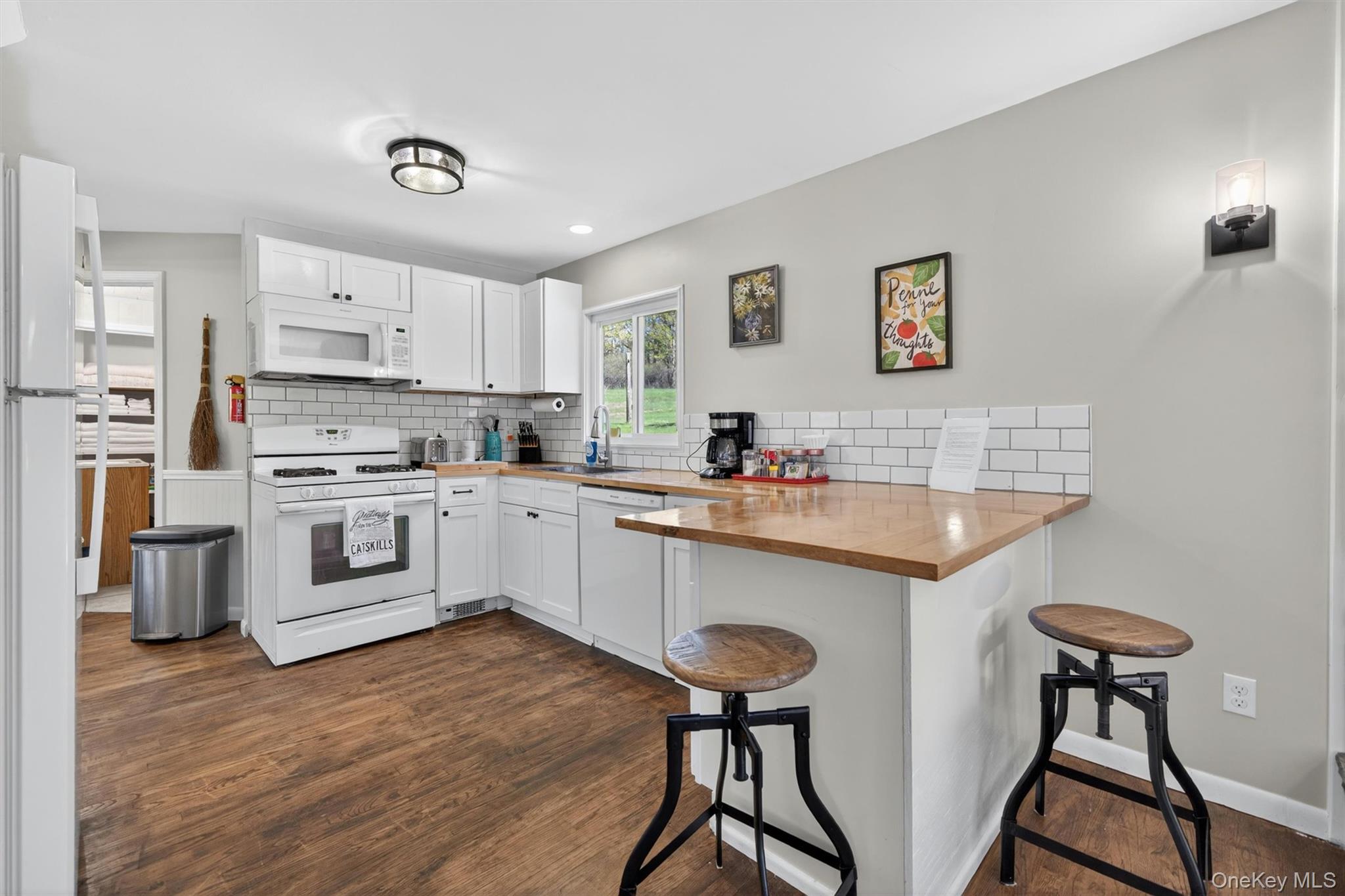 35 Yaun Road Livingston Manor, NY 12758 - Photo 13 of 38 a kitchen with stainless steel appliances granite countertop a white cabinets and wooden floor
