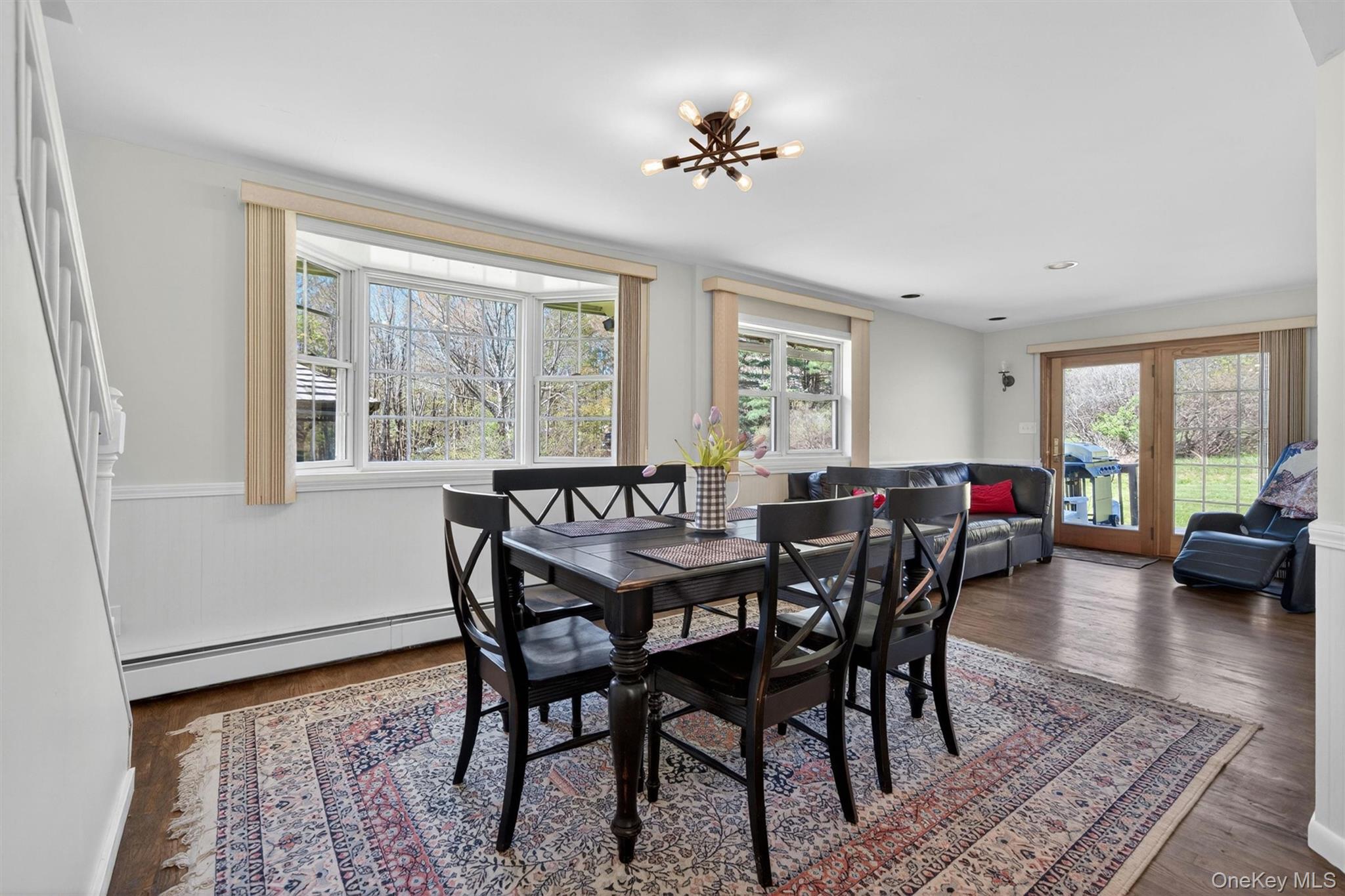 35 Yaun Road Livingston Manor, NY 12758 - Photo 17 of 38 a view of a dining room with furniture a rug and wooden floor