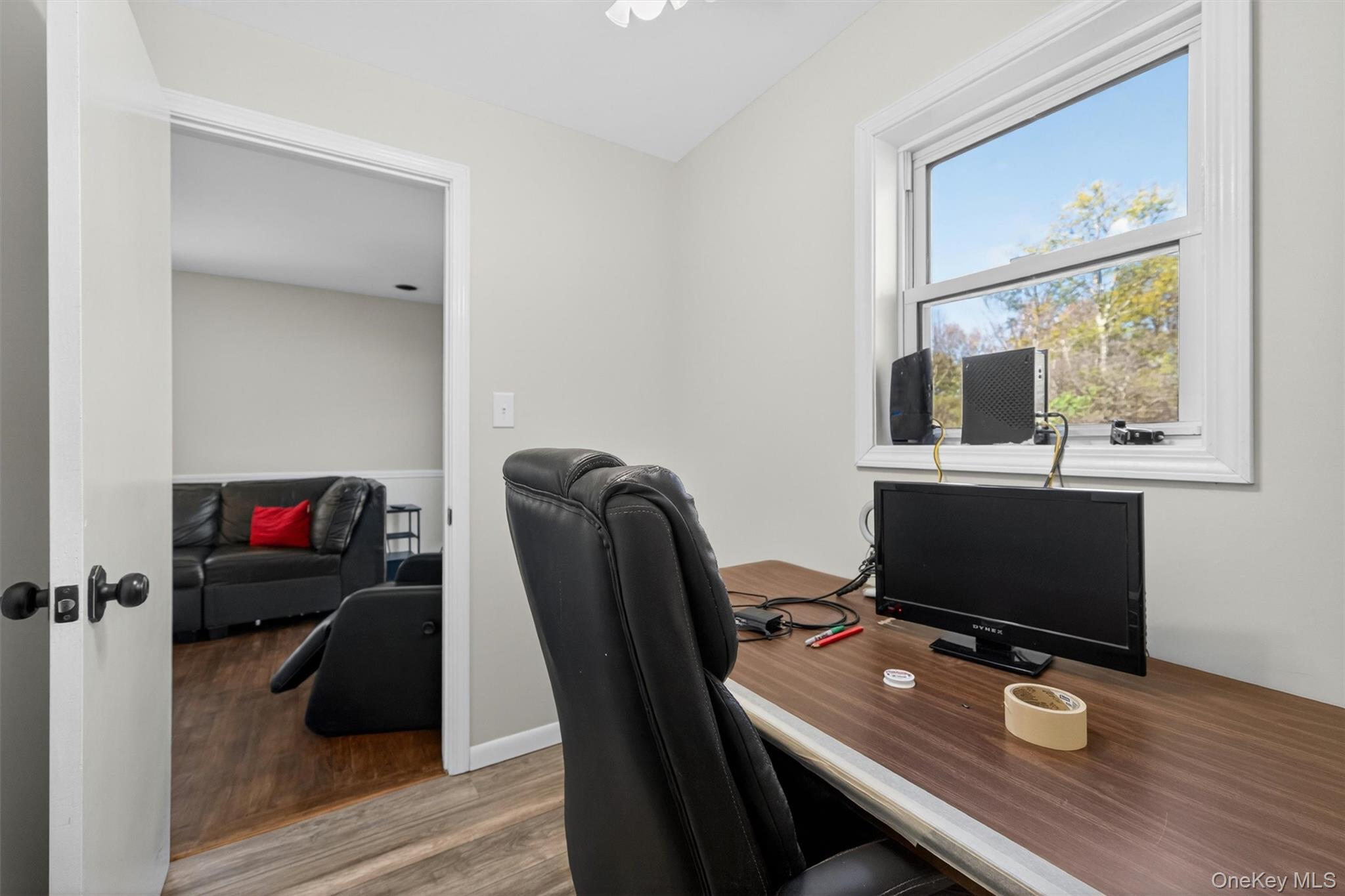 35 Yaun Road Livingston Manor, NY 12758 - Photo 22 of 38 a view of a workspace with furniture and a floor to ceiling window