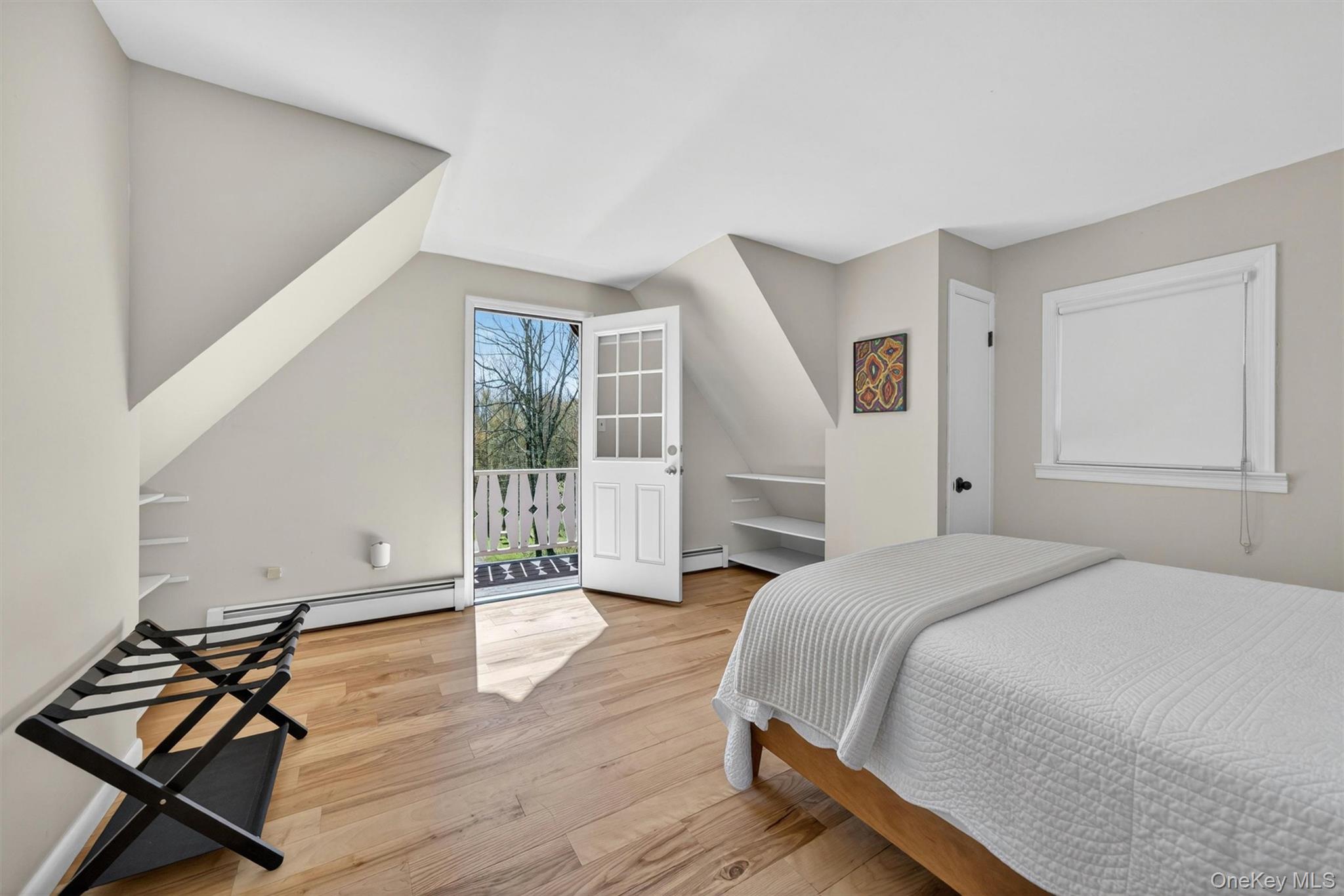 35 Yaun Road Livingston Manor, NY 12758 - Photo 30 of 38 a spacious bedroom with a bed and wooden floor