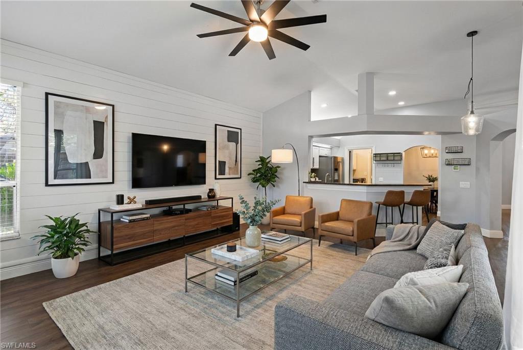 22932 Forest Ridge Drive Estero, FL 33928 - Photo 12 of 41 a living room with furniture and a flat screen tv