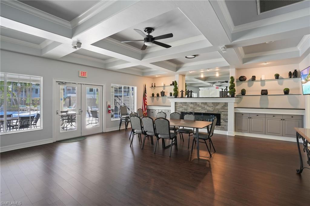22932 Forest Ridge Drive Estero, FL 33928 - Photo 40 of 41 a view of a dining room with furniture and wooden floor