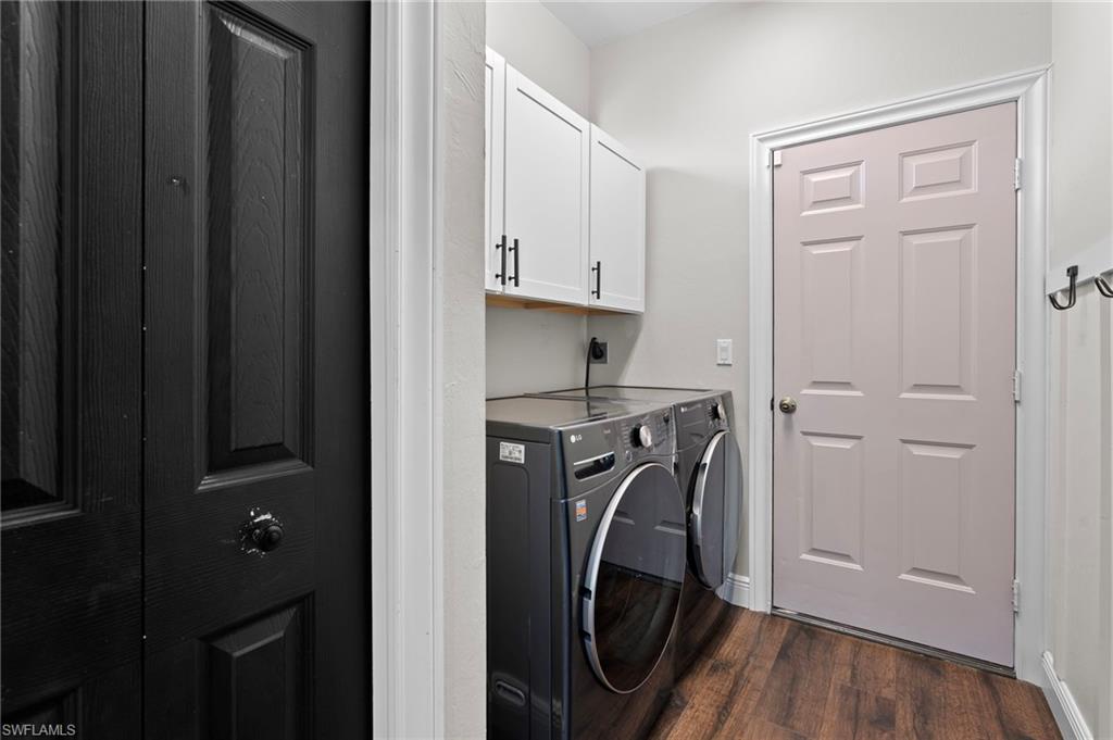 22932 Forest Ridge Drive Estero, FL 33928 - Photo 10 of 41 a view of walk in closet with clothes shoes and a washer dryer