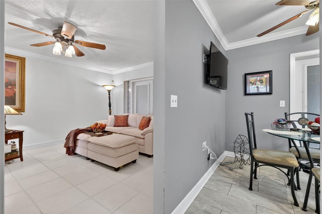 575 Tiberon Cove Road Longwood, FL 32750 - Photo 11 of 56 a living room with furniture and a flat screen tv