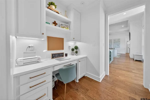 a hallway with a sink and a refrigerator