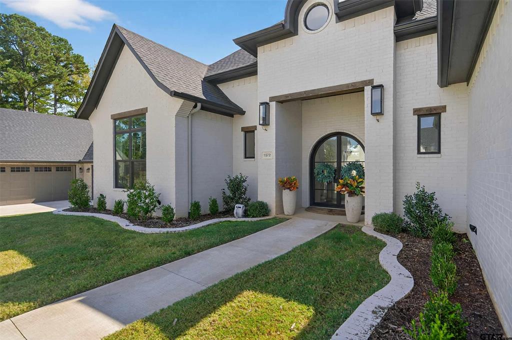 1572 Maple Lane Tyler, TX 75703 - Photo 2 of 40 a front view of a house with garden