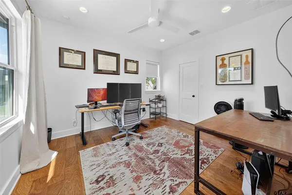 a workspace with furniture and window