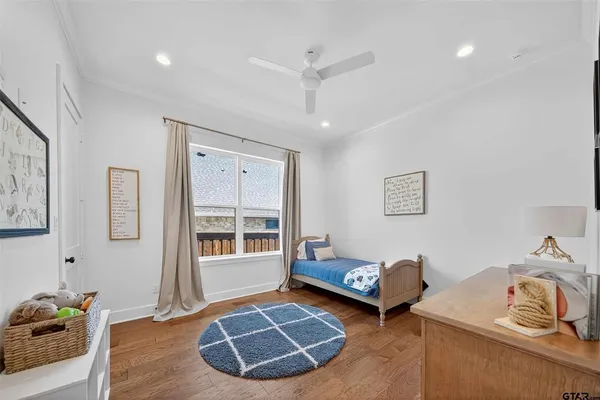 a bedroom with furniture and a window