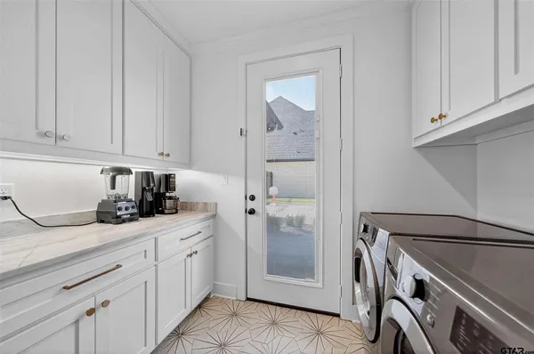 a kitchen with a sink and cabinets