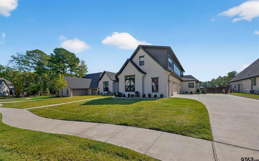 1572 Maple Lane Tyler, TX 75703 - Photo 4 of 40 a front view of a house with a yard