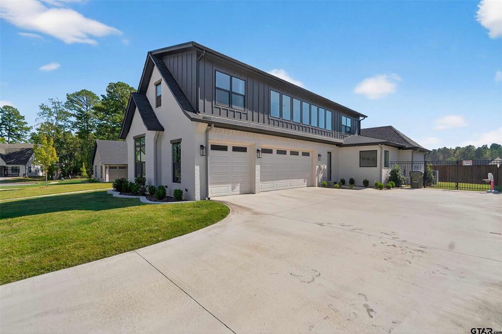 1572 Maple Lane Tyler, TX 75703 - Photo 5 of 40 a front view of a house with a yard and garage