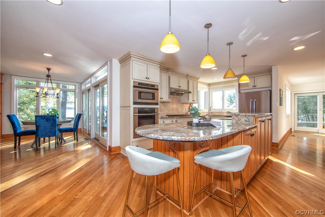 4206 Winterberry Court Midlothian, VA 23112 - Photo 13 of 50 an open kitchen with dining table and chairs