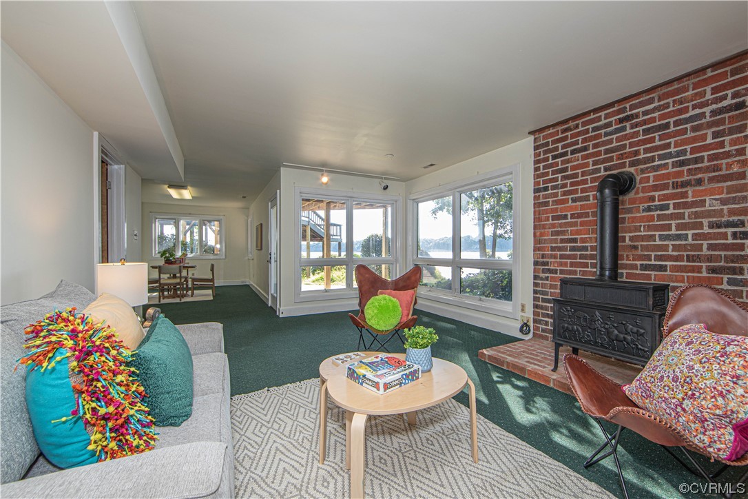 4206 Winterberry Court Midlothian, VA 23112 - Photo 29 of 50 a living room with furniture and a fireplace
