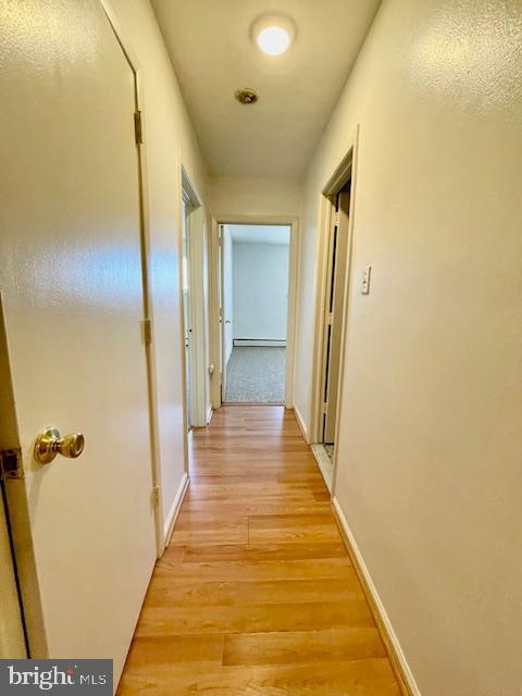 141 East 4th Avenue, Unit C6 Conshohocken, PA 19428 - Photo 4 of 7 a view of a hallway with wooden floor and staircase