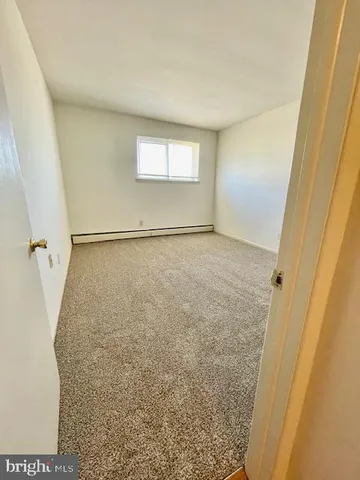 a bathroom with a granite countertop window and a shower