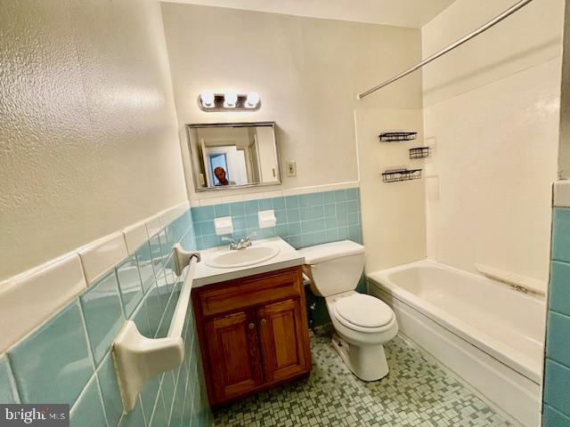141 East 4th Avenue, Unit C6 Conshohocken, PA 19428 - Photo 7 of 7 a bathroom with a granite countertop toilet sink and mirror