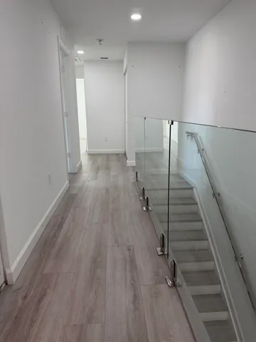 an empty room with wooden floor