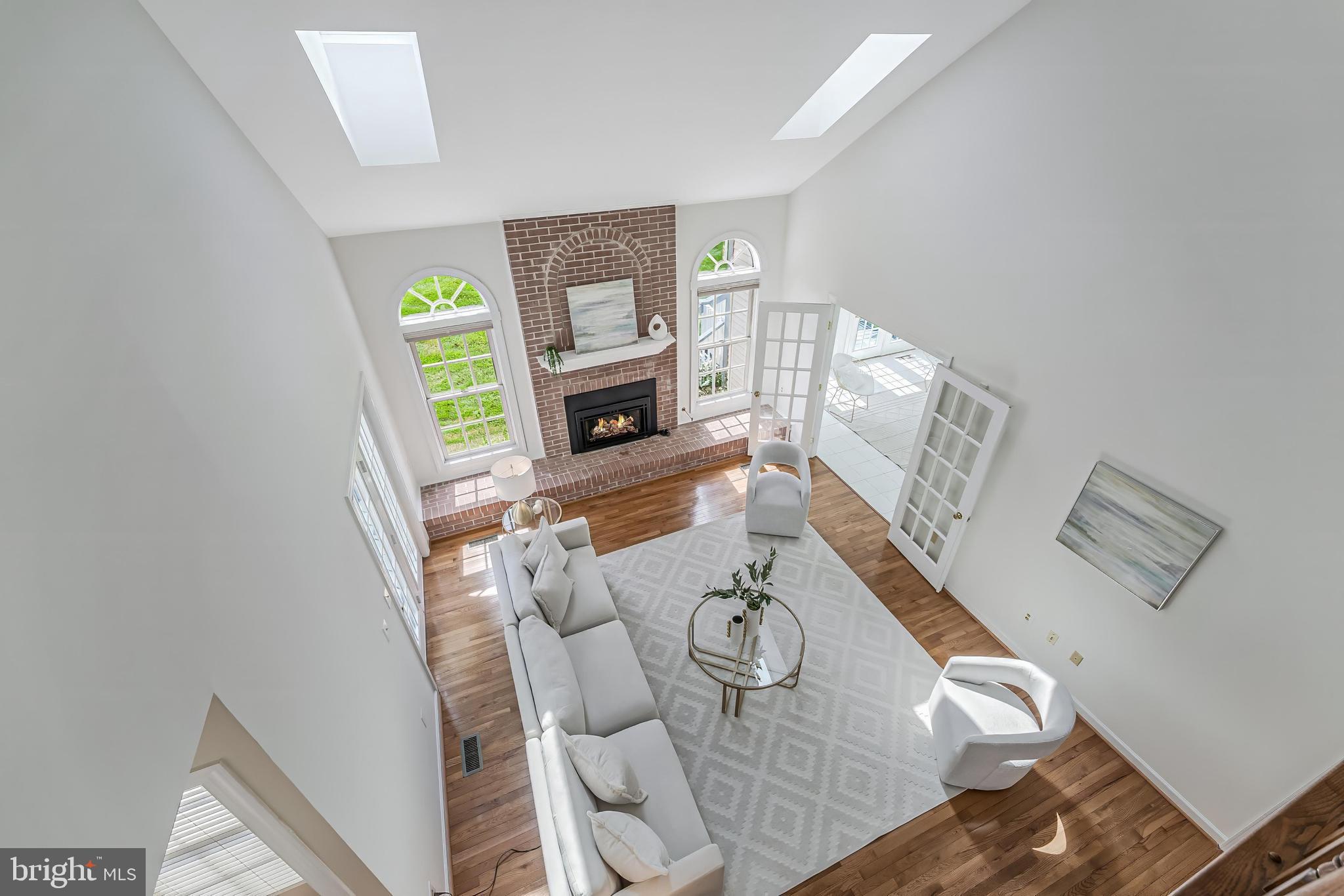 5501 Ashleigh Road Fairfax, VA 22030 - Photo 38 of 77 a living room with furniture and a fireplace