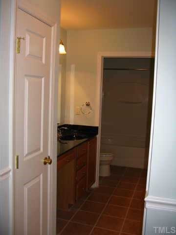 8311 Hempshire Place Raleigh, NC 27613 - Photo 7 of 7 The master bath has beautiful color, black marble countertop, oversized tub and large walk-in closet Other