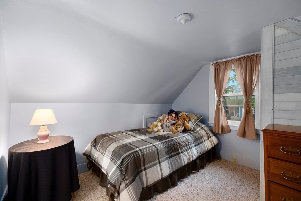 102 Orange Street Reading, MA 01867 - Photo 14 of 23 a bedroom with a bed and window