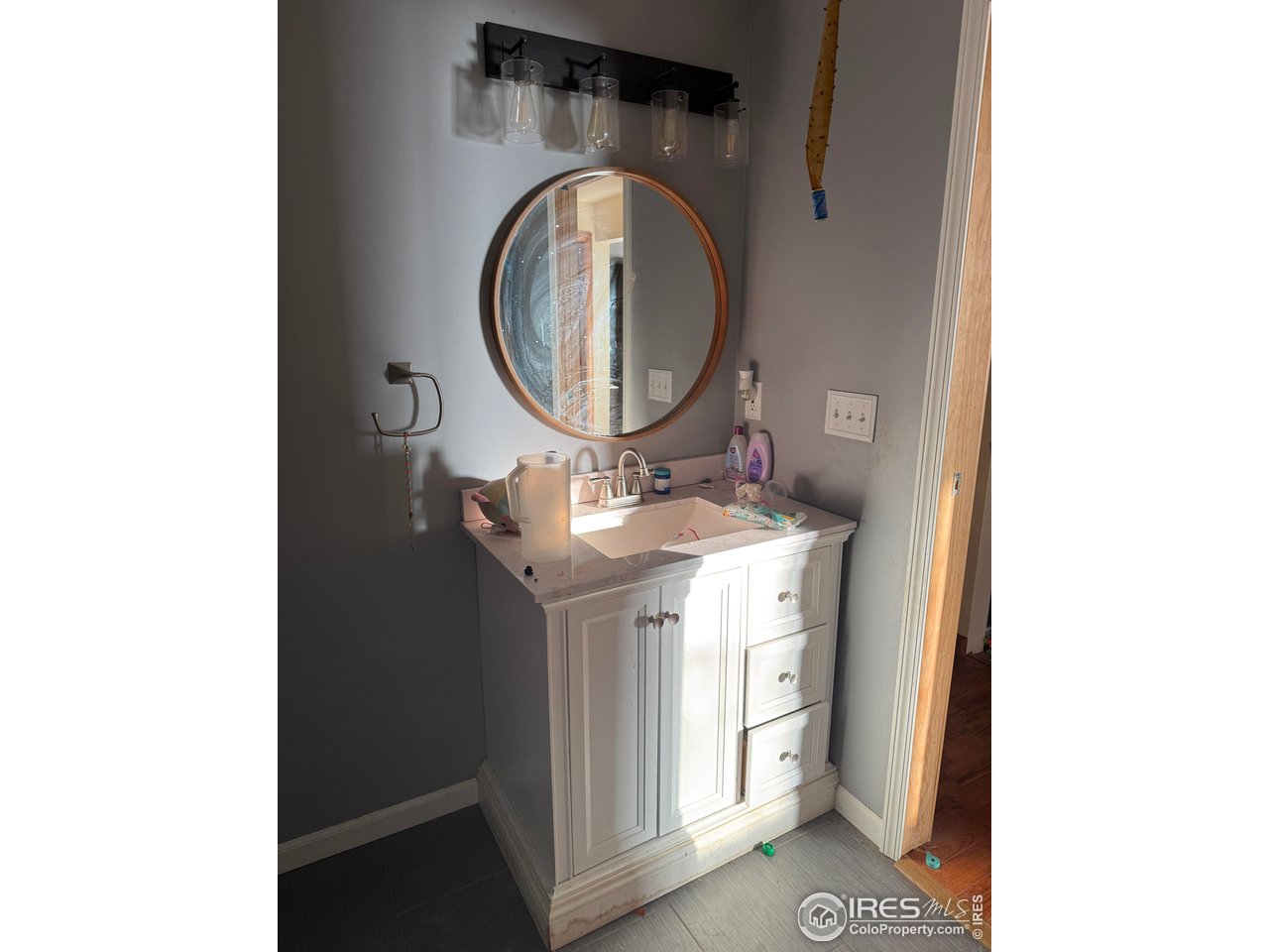 375 West 7th Street Akron, CO 80720 - Photo 18 of 50 a bathroom with a sink and a mirror