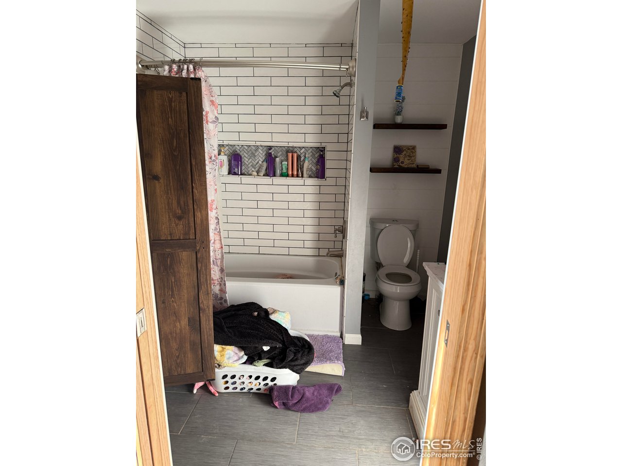 375 West 7th Street Akron, CO 80720 - Photo 19 of 50 a bathroom with a toilet and shower